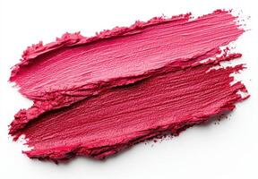 Vibrant red lipstick smear on white background photo