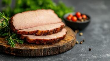 Sliced roasted pork loin with herbs and spices photo