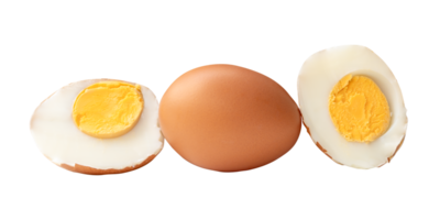 Side view of boiled or cooked brown chicken eggs with halves and egg yolk in stack isolated with clipping path in file format png