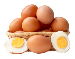 Side view of boiled or cooked brown chicken egg with halves and egg yolk and raw eggs in stack in wicker basket isolated with clipping path in file format png