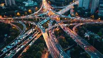 An aerial view of a busy highway intersection at night video