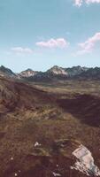 An aerial view of a mountain range in the mountains video