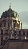 A tall building with a flag on top of it video