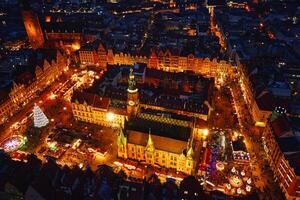 Aerial view of festive Christmas market at night in Wroclaw, Poland photo