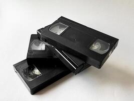 Retro vhs tapes on white background reflecting nostalgic technology photo