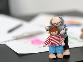 Quirky clay figurines displaying creative expressions on a sketchpad photo