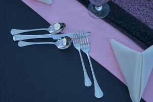 Holidays romantic, dinner table and setting for valentines day, fine dining or date at indoor night restaurant. Interior diner for evening couple reservation photo