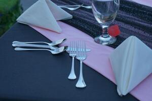 Holidays romantic, dinner table and setting for valentines day, fine dining or date at indoor night restaurant. Interior diner for evening couple reservation photo