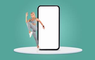 A dancer energetically leaps out from behind a large smartphone display in a vibrant studio setting. The scene captures movement and creativity, emphasizing a fusion of technology and art. photo