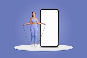 A young woman wears a matching athletic outfit while jumping rope beside an oversized smartphone display. The vibrant background emphasizes her energetic workout pose and enthusiasm for fitness. photo