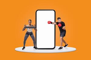 A woman exercises with a tablet while a man practices boxing with gloves. Their surroundings are bright orange, highlighting the blend of technology and physical training. photo