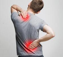 Spine osteoporosis. Scoliosis. Spinal cord problems on man's back. photo