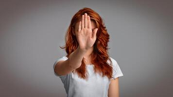 Unrecognizable Girl Gesturing Stop Warning About Danger Standing In Studio Over Gray Background. Panorama photo