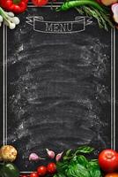 Design concept for restaurant menu mockup. Black rustic chalkboard with white inscription and vegetables frame, top view, copy space for text and logo, vegetarian cafe concept photo