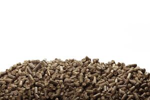 Wood pellets in the background. photo