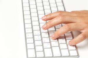 Woman's hands on a keyboard photo