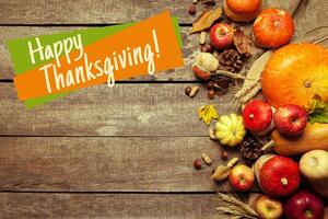 Happy thanksgiving day display on wooden background photo