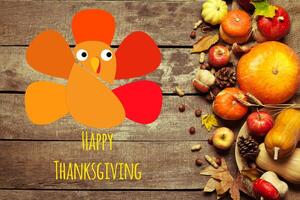 Happy thanksgiving day display on wooden background photo