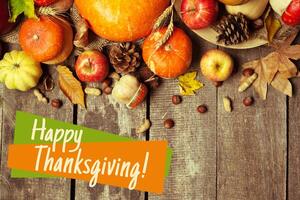 Happy thanksgiving day display on wooden background photo