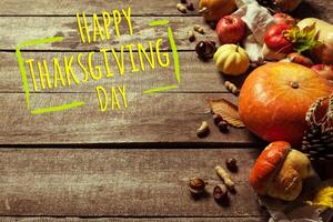Happy thanksgiving day display on wooden background photo