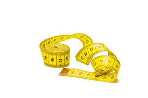 yellow metric measuring tape isolated on white panorama background photo