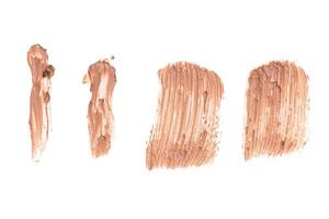 smeared foundation natural make up on white background photo
