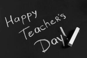 text happy teachers day written on a chalkboard photo