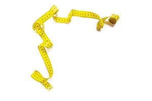 yellow metric measuring tape isolated on white panorama background photo