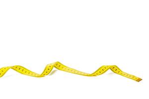 yellow metric measuring tape isolated on white panorama background photo