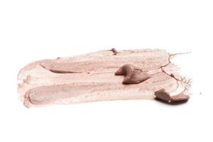 smeared foundation natural make up on white background photo