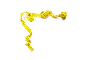yellow metric measuring tape isolated on white panorama background photo