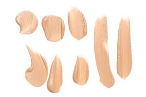 smeared foundation natural make up on white background photo