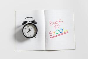 text back to school with open page notebook photo