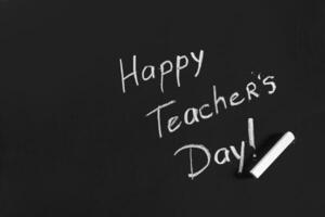 text happy teachers day written on a chalkboard photo