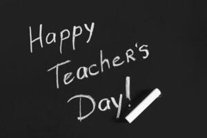 text happy teachers day written on a chalkboard photo