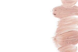 smeared foundation natural make up on white background photo