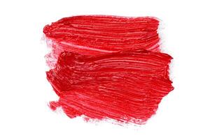 Smudged lipsticks isolated on white background photo