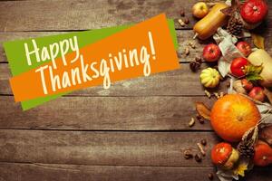 Happy thanksgiving day display on wooden background photo