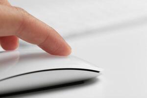 Hand with computer mouse photo