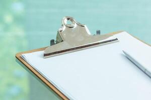 Office clipboard on the table close up photo