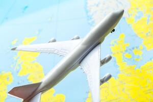 miniature of a passenger aircraft flying on a map photo
