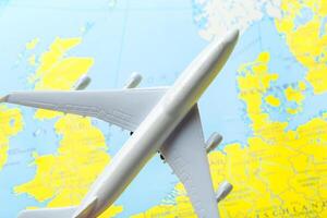 miniature of a passenger aircraft flying on a map photo