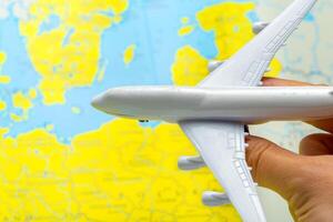 miniature of a passenger aircraft flying on a map photo