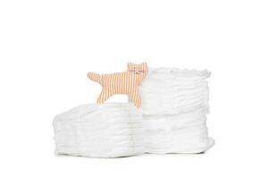 Stack of diapers isolated on white background photo