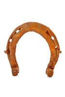 Old rusty horseshoe isolated on white photo