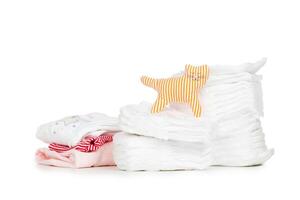 Stack of diapers isolated on white background photo