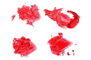 Smudged lipsticks isolated on white background photo
