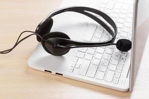 headset on keyboard computer laptop photo