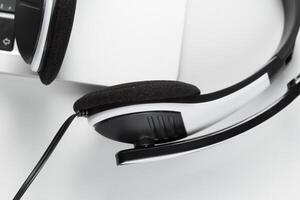 call center support concept. headset on keyboard computer laptop photo