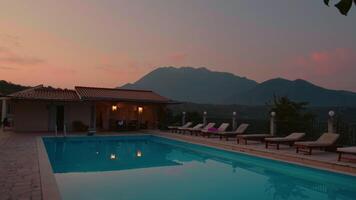 Pictoresque view of the mountains in background of private pool resort. video